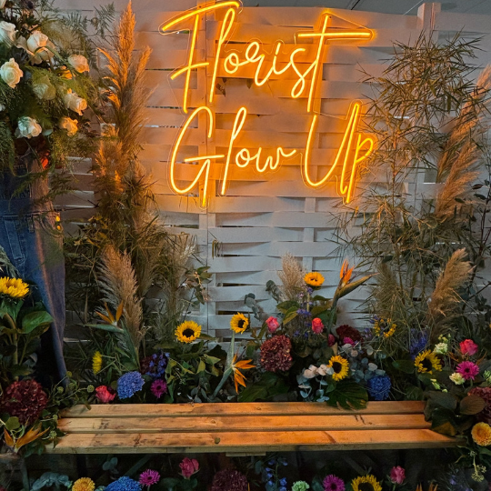 Large colourful flower installation with selfie bench